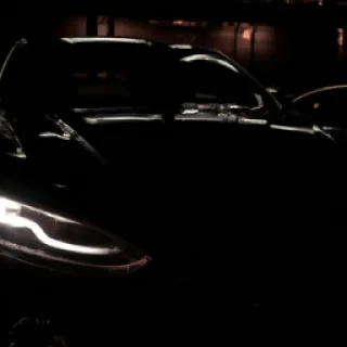 Luxury car at night, dark aesthetic, cinematic lighting, success lifestyle, 4k, vertical
